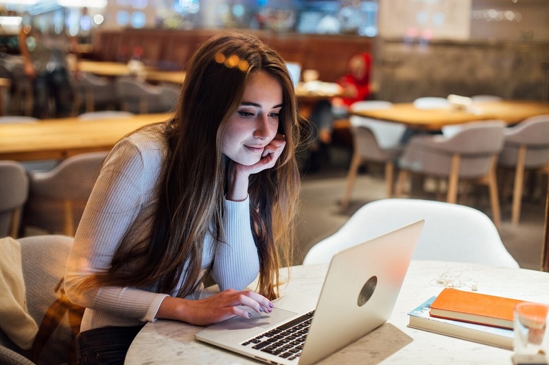 woman using laptop while working